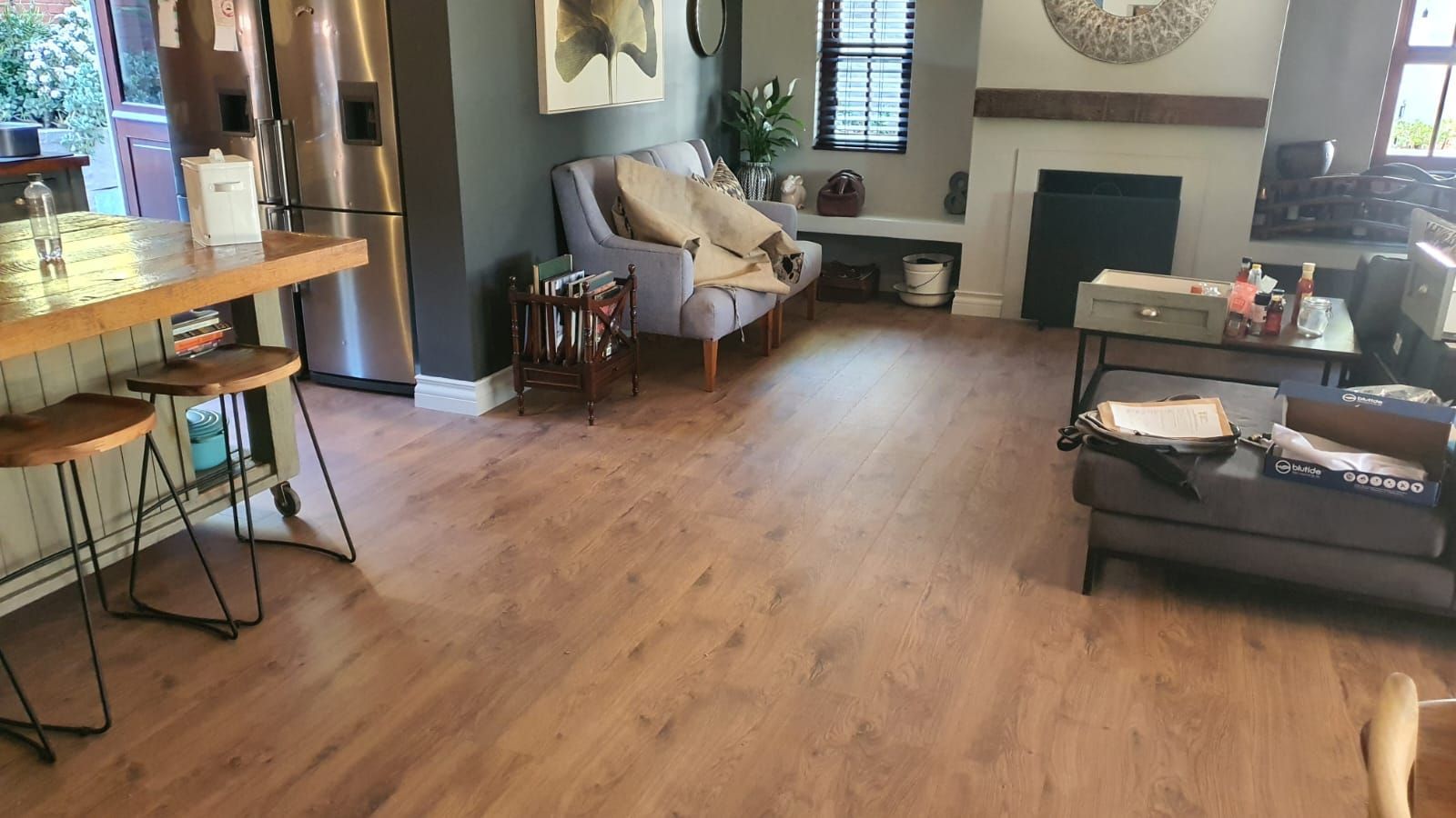 A living room filled with furniture and a fireplace.