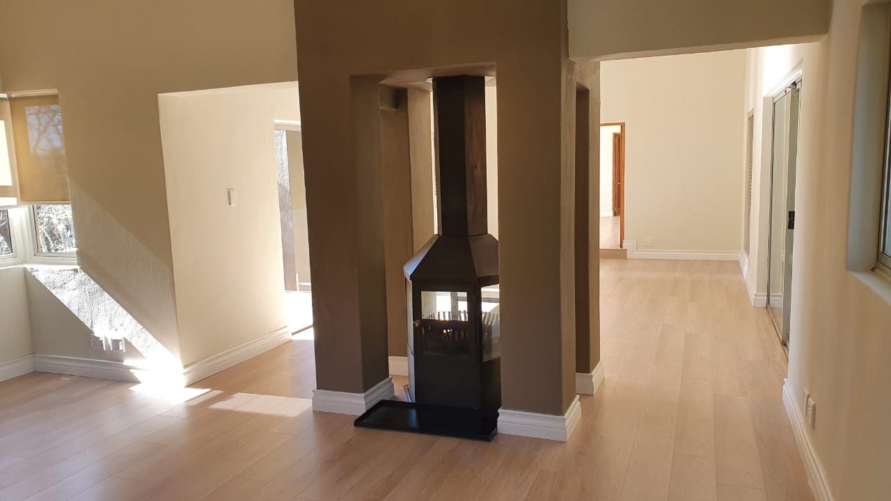 There is a fireplace in the middle of the room.