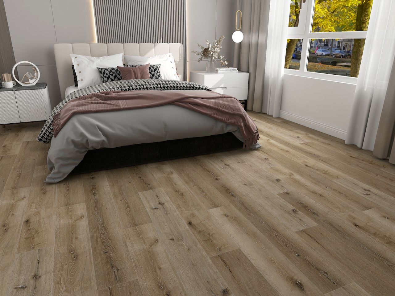 A bedroom with hardwood floors and a bed.