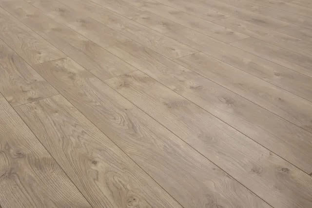 A close up of a wooden floor in a room.