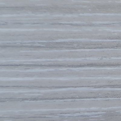 A close up of a gray wood grain texture.