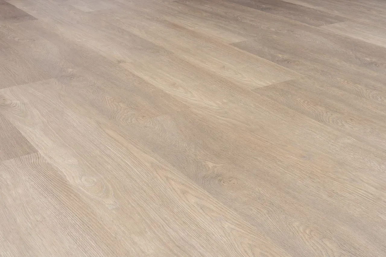 A close up of a wooden floor in a room.