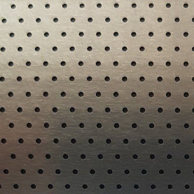 A close up of a metal surface with holes in it