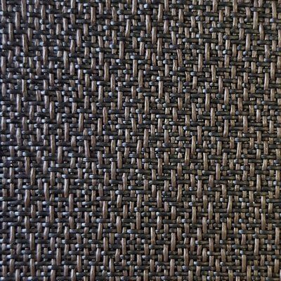 A close up of a woven fabric with a geometric pattern