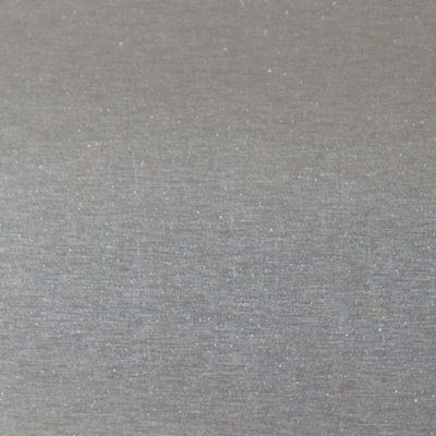 A close up of a gray surface with a grainy texture.