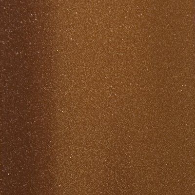 A close up of a brown surface with a lot of small dots on it.