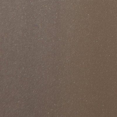 A close up of a brown surface with a lot of small dots on it.