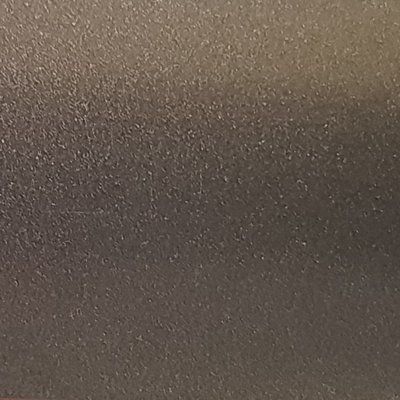 A close up of a metal surface with a grainy texture.