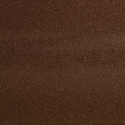 A close up of a brown surface with a grainy texture.