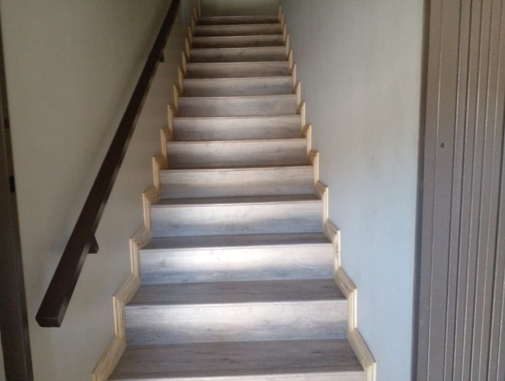 A set of stairs leading up to the second floor of a house.