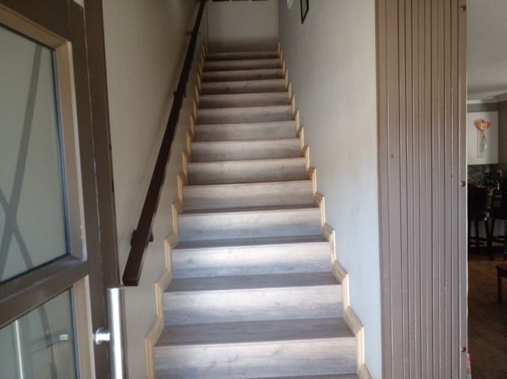 A set of stairs leading up to the second floor of a house