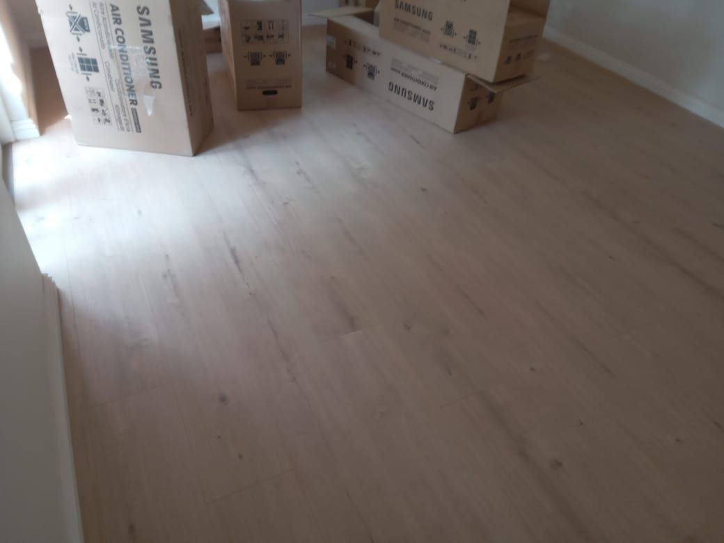 A room with boxes stacked on top of each other on the floor.