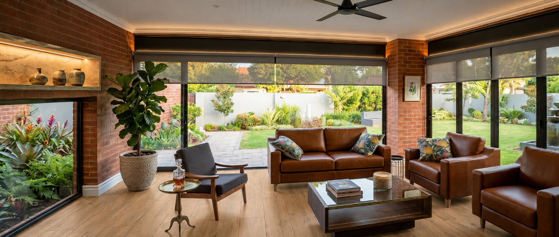 Modern living room with laminate flooring, leather furniture, and garden views