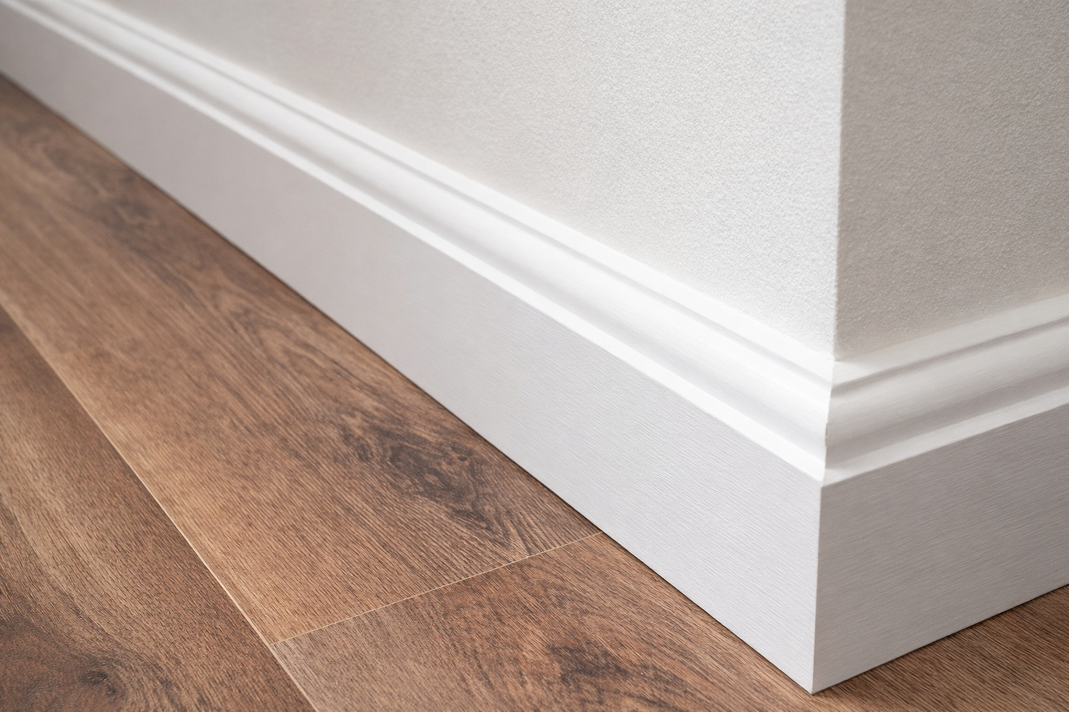 White MDF skirting board installed with laminate flooring and vinyl flooring 