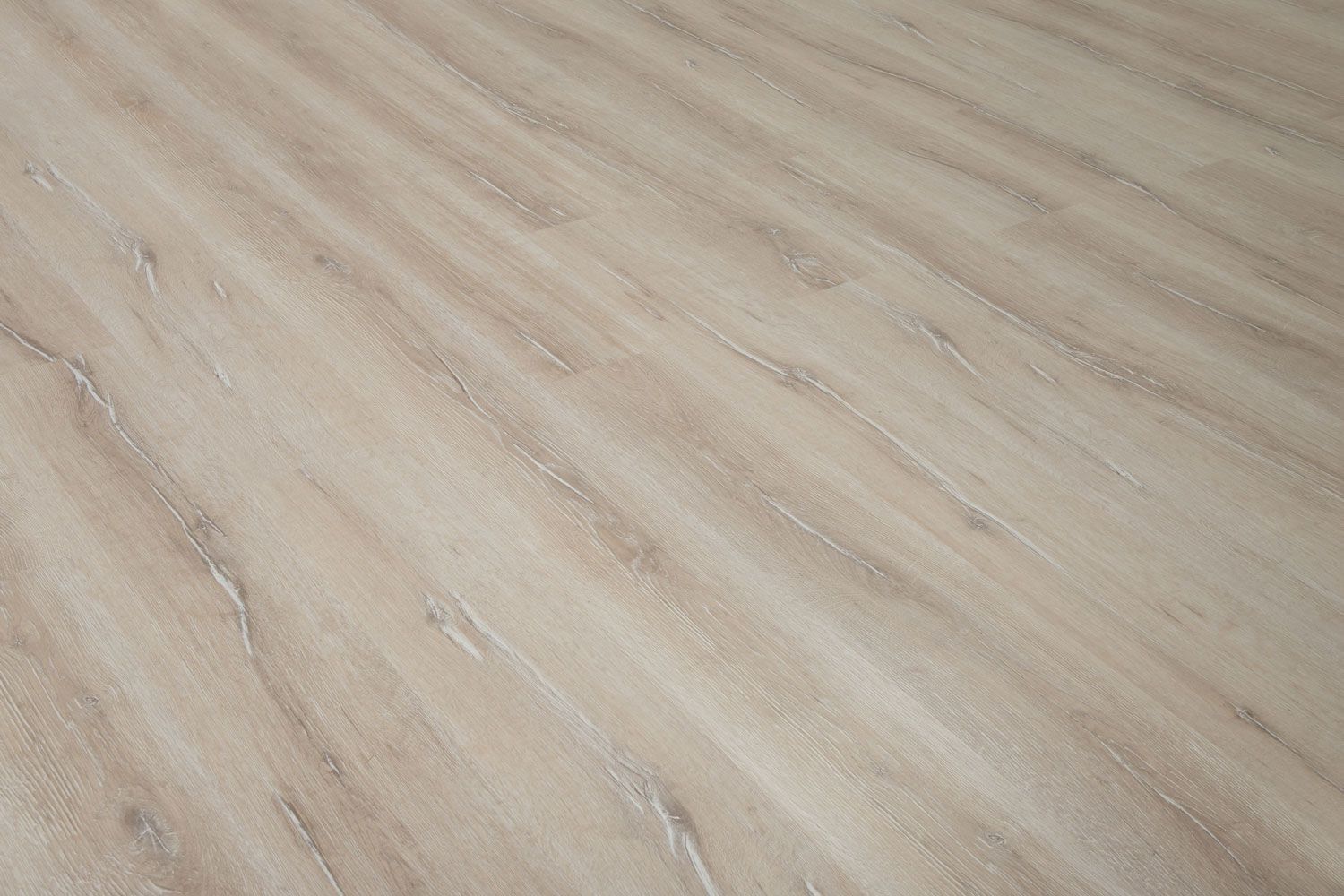 A close up of a wooden floor in a room.