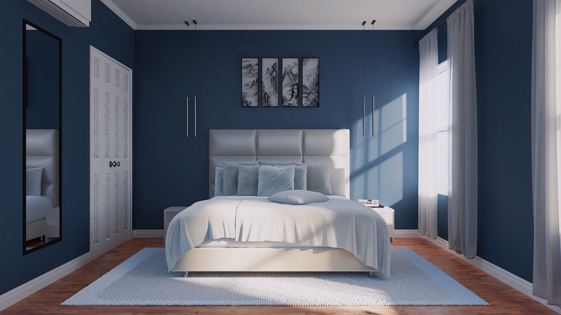 A bedroom with blue walls and a white bed.