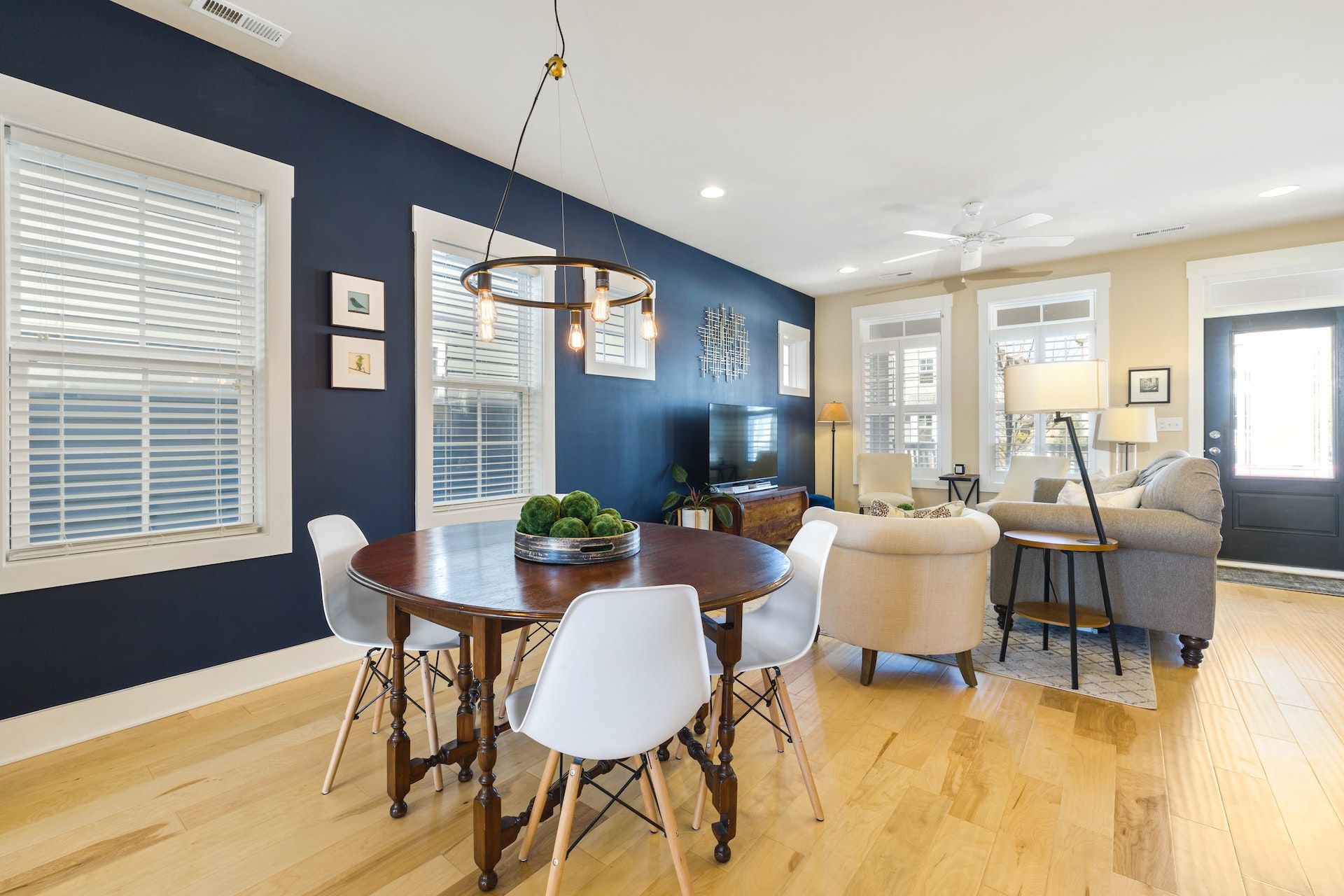 There is a dining table and chairs in the middle of the room.