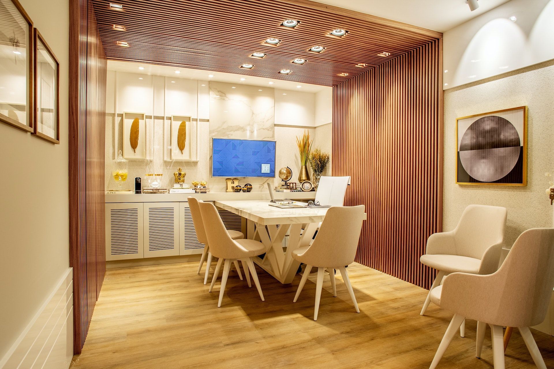 A dining room with a table and chairs in it.