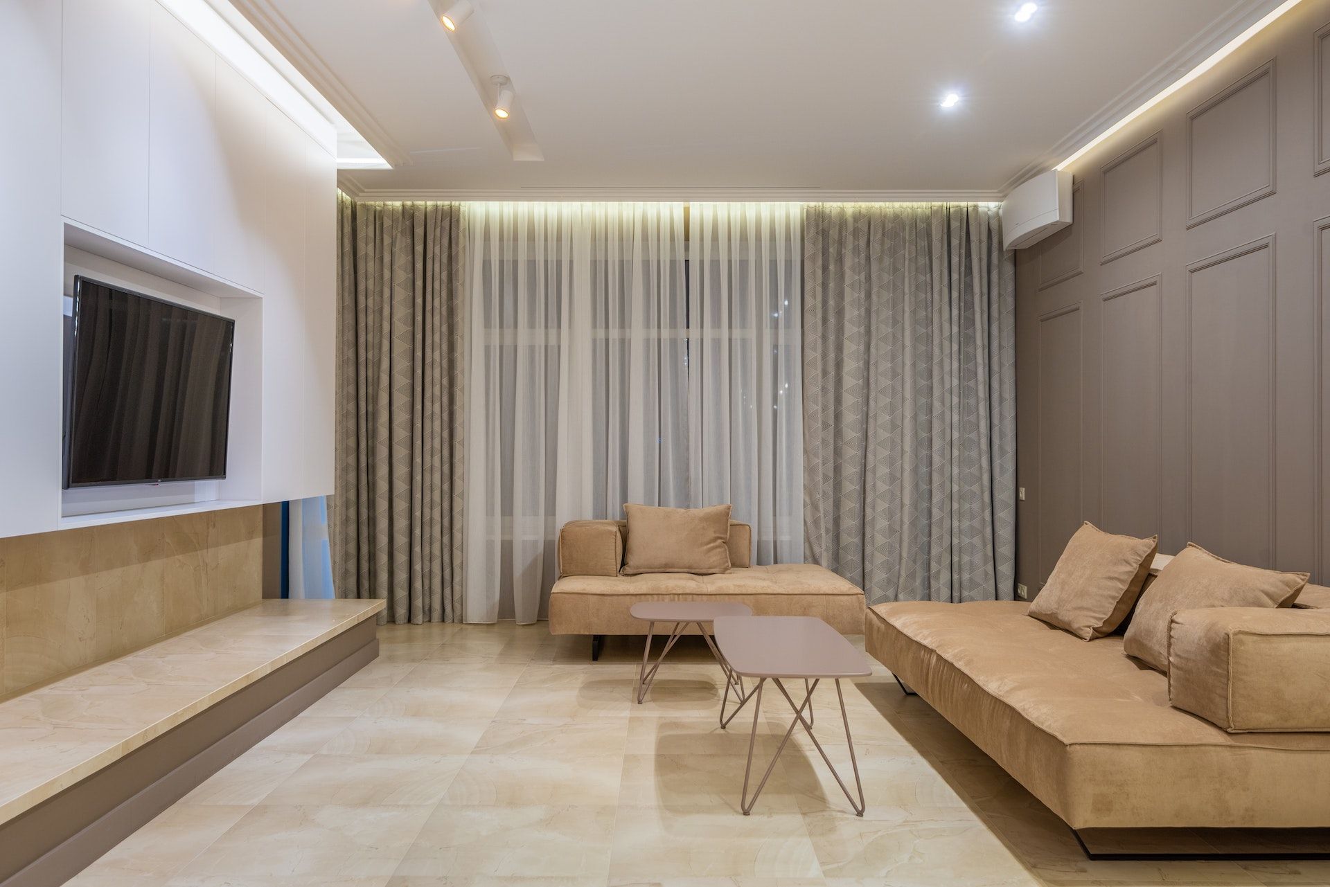 A living room with a couch , table , and television.