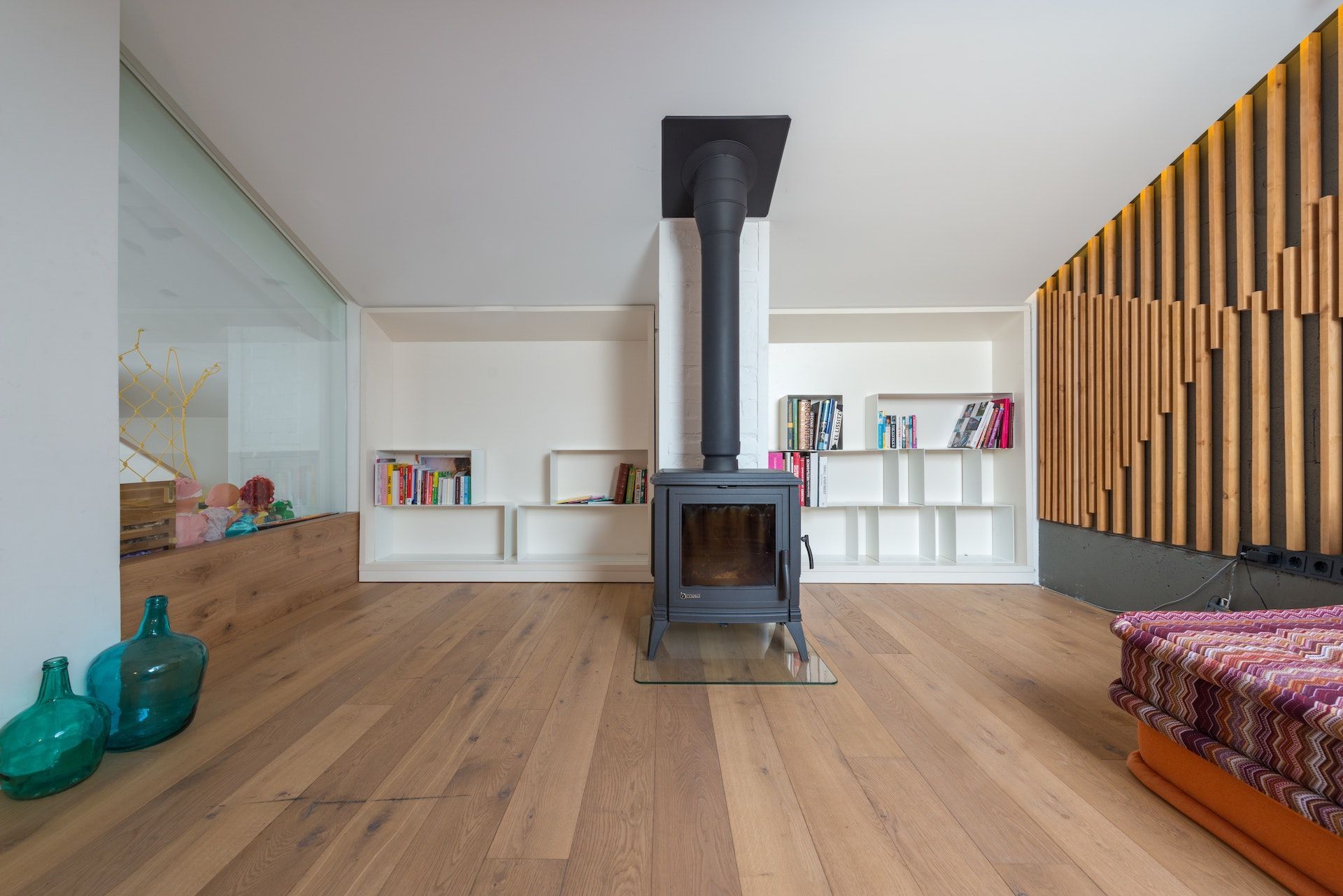 There is a wood stove in the middle of the room.
