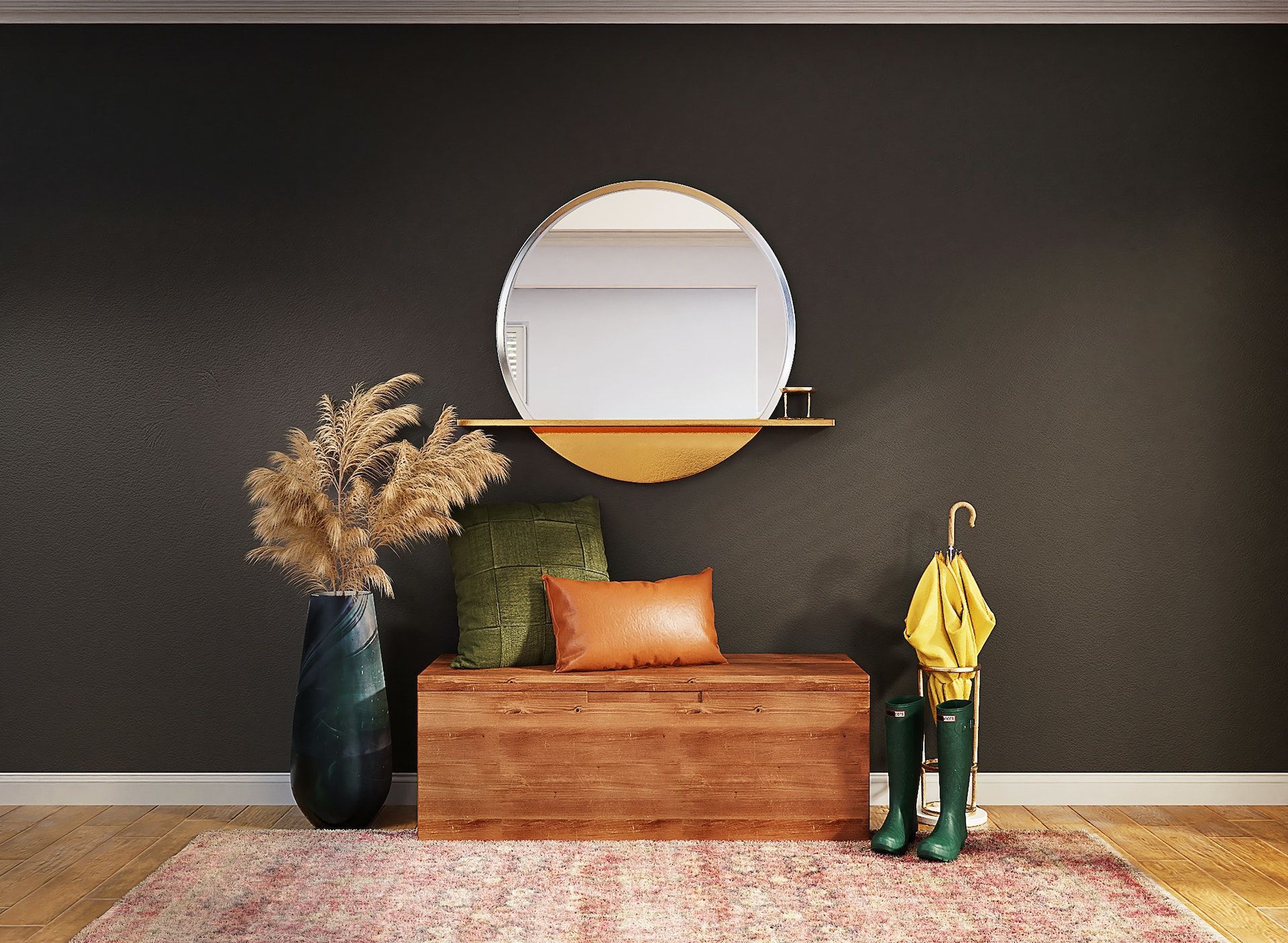 A hallway with a wooden bench , a round mirror , a vase of flowers , and a rug.
