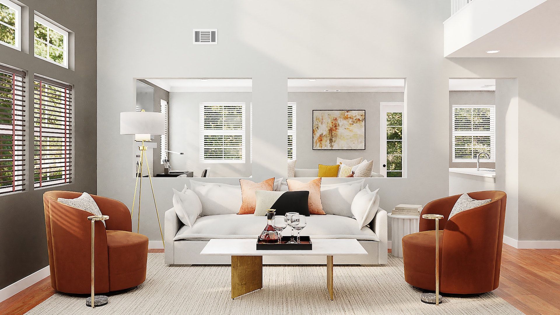 A living room with a couch , two chairs , a coffee table and a rug.