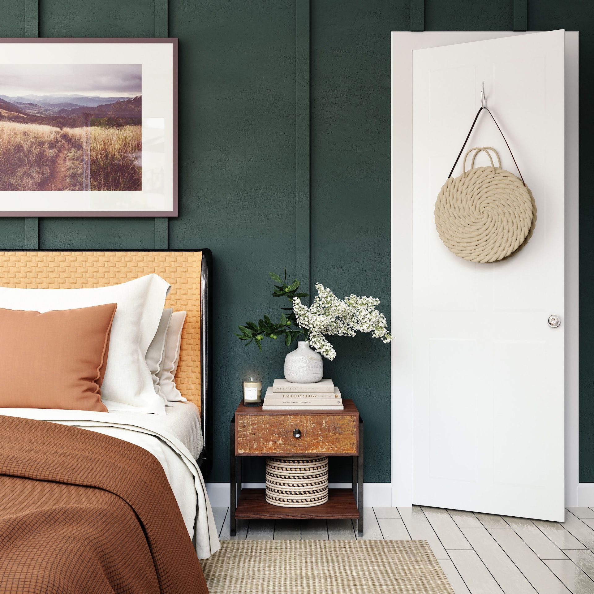A bedroom with a bed , nightstand and a picture on the wall