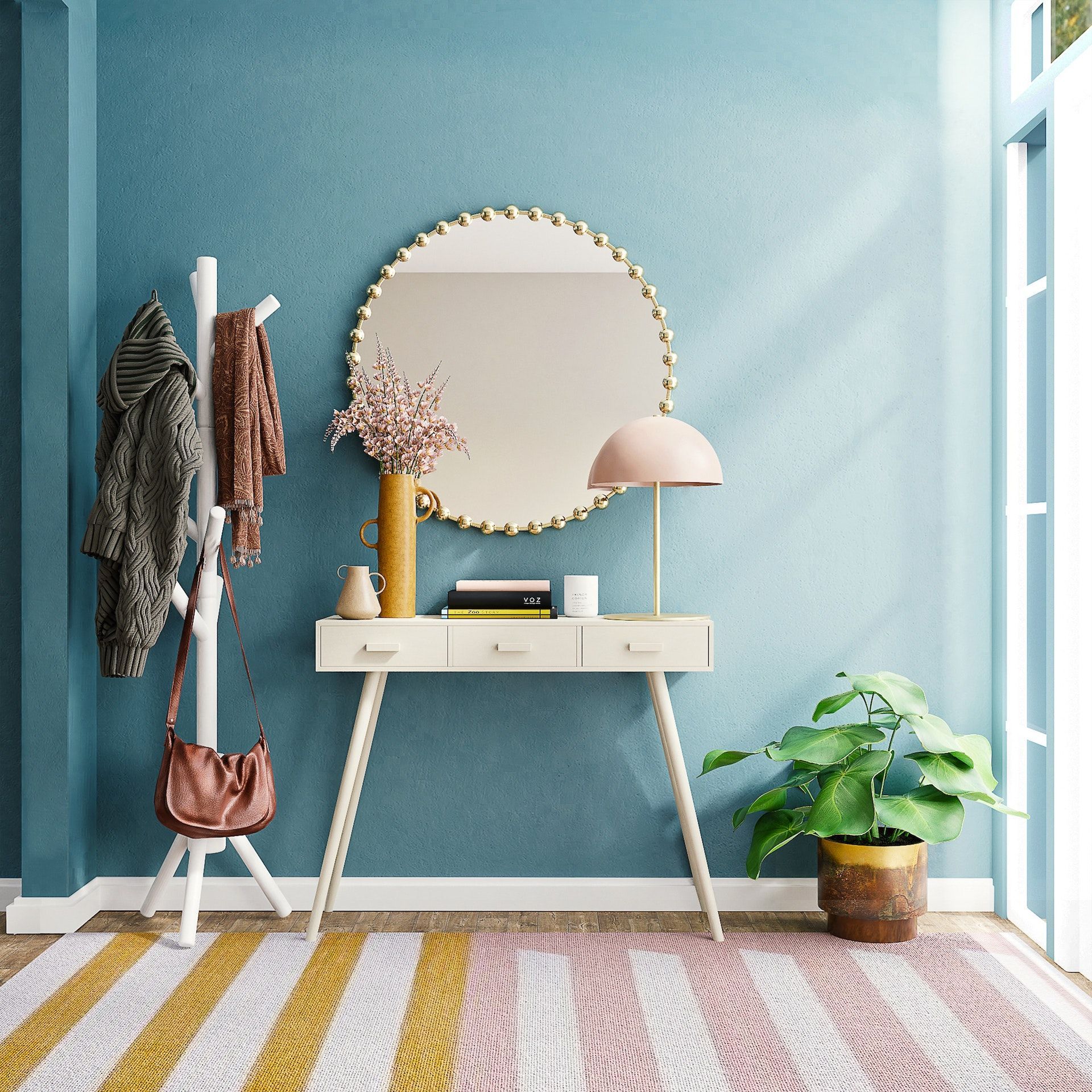 A hallway with a table , mirror , lamp and a plant.