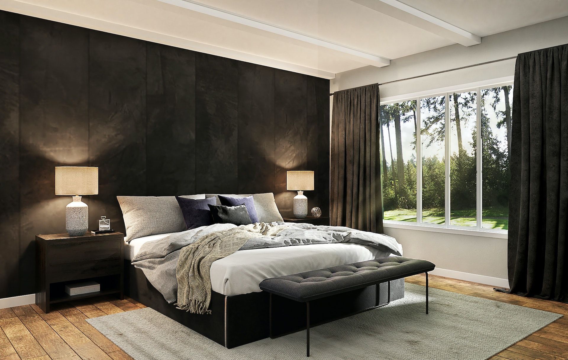 A bedroom with a bed , nightstand , lamps and a window.