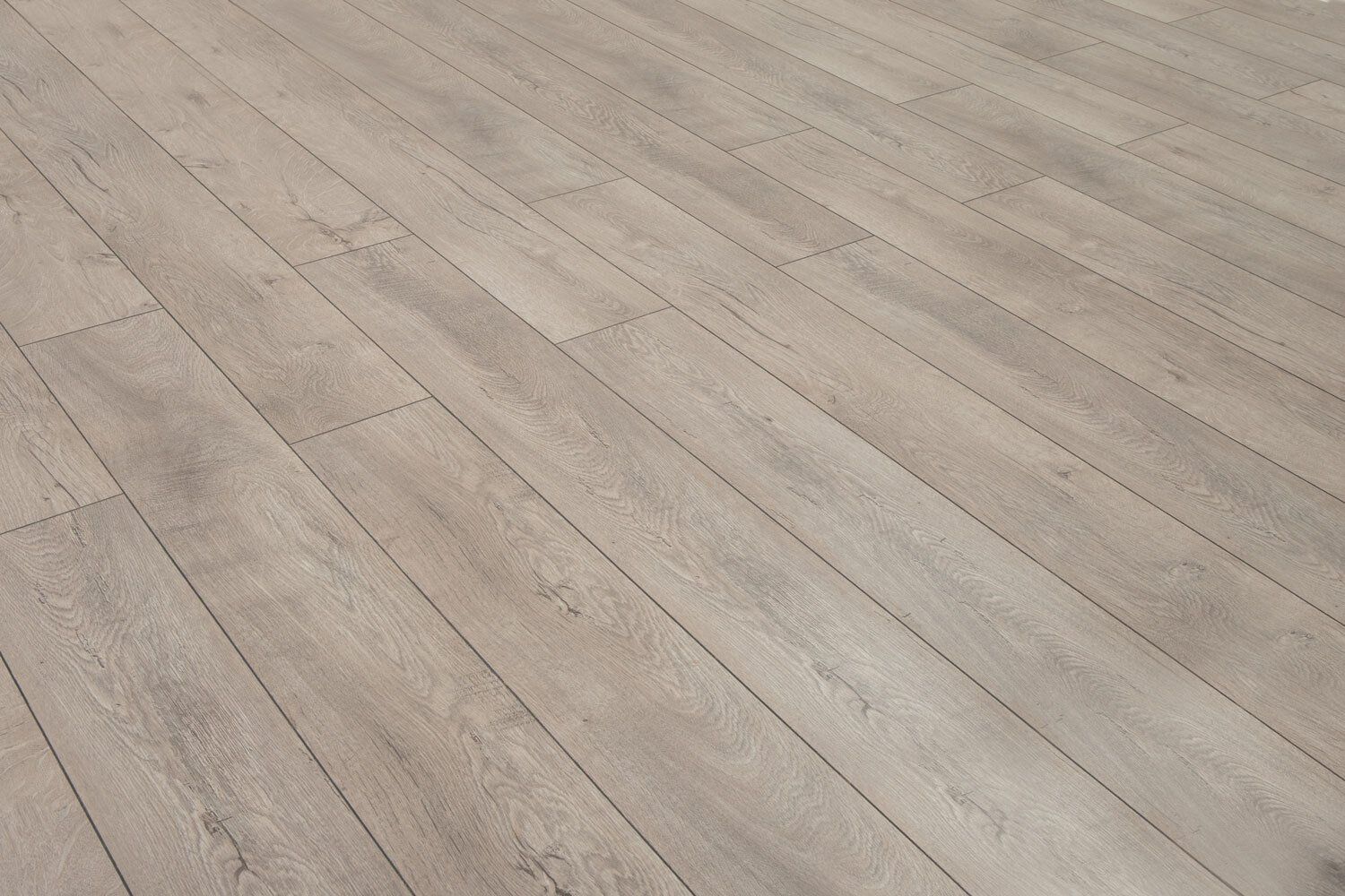 A close up of a wooden floor in a room.