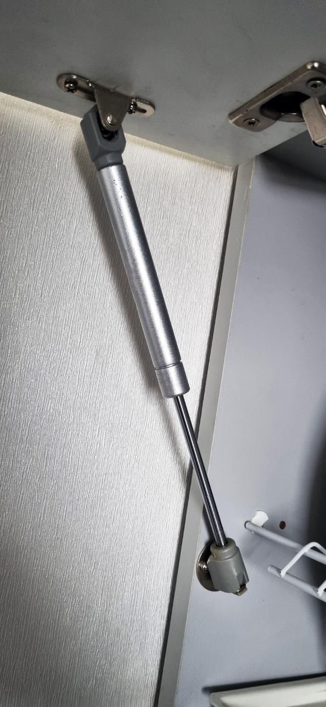 A Close Up of a Gas Spring on a Cabinet Door — Strut Re-gas Mackay In Ooralea, QLD