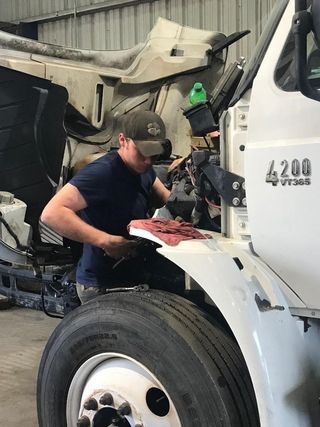Augusta Trailer Repair — Truck Driver Working On Truck in Augusta, GA