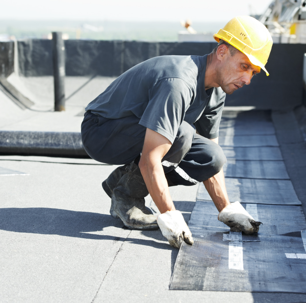 roofer installing shingles
