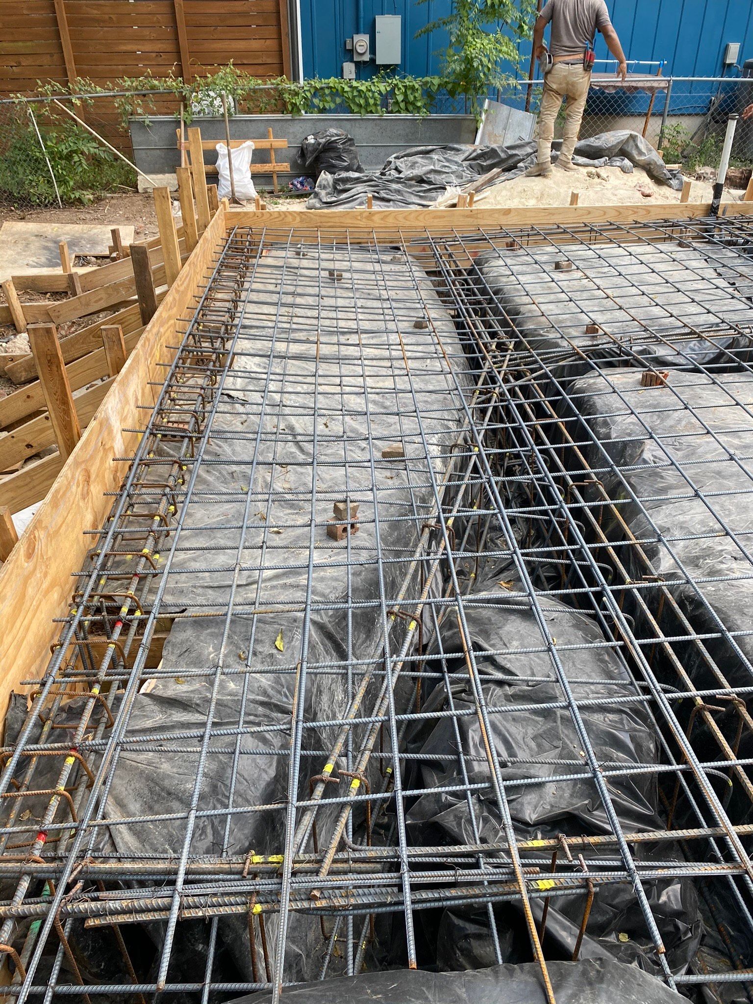 A man is standing on top of a concrete slab.