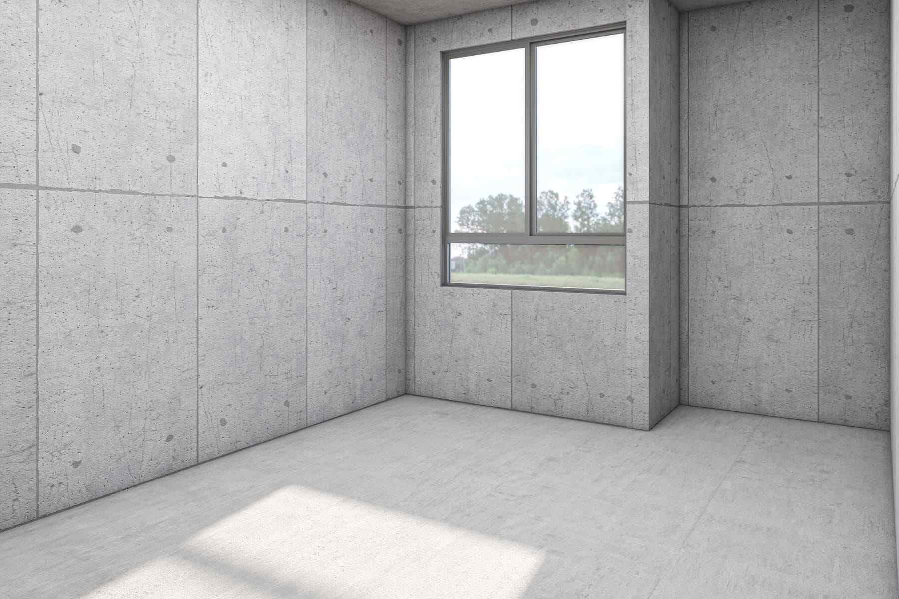 Una habitación vacía con paredes de hormigón y una ventana.