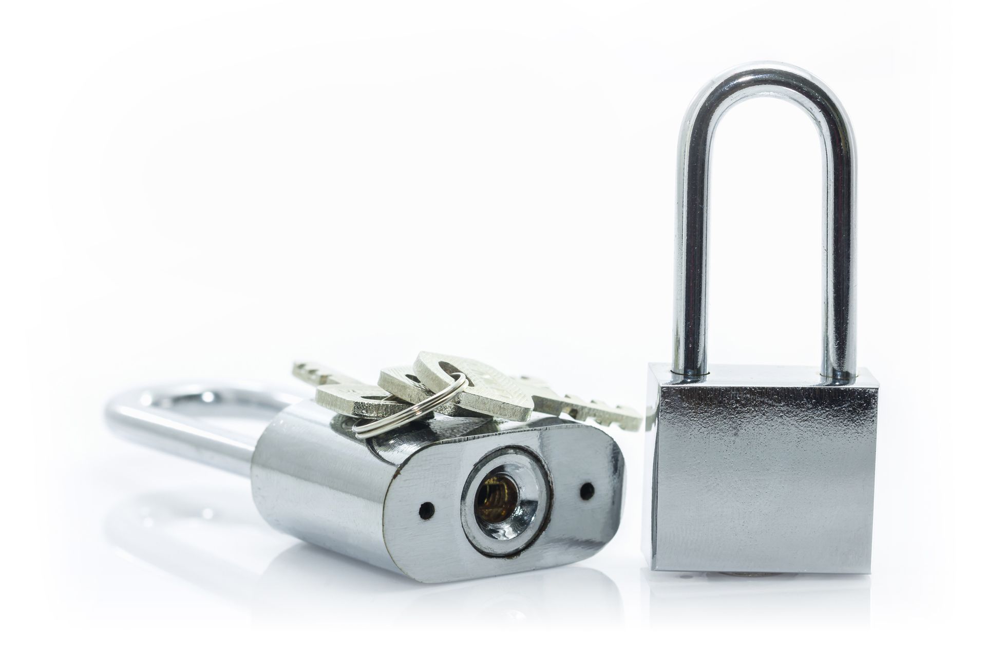 Two silver padlocks, one open with keys, the other closed.