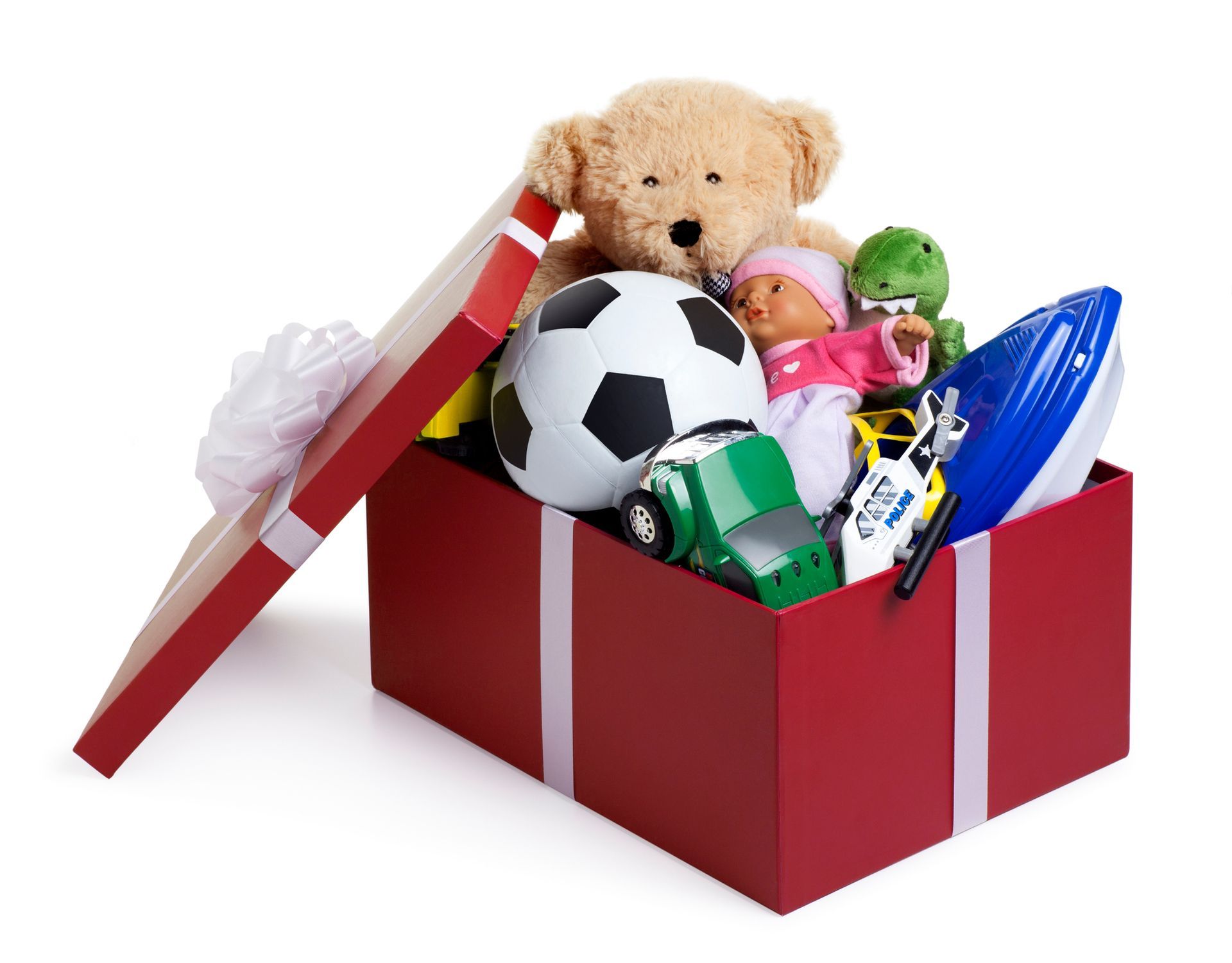 Red gift box overflowing with toys: teddy bear, soccer ball, doll, car, and more.