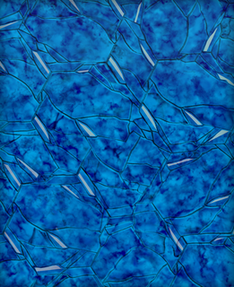 Abstract blue pattern of irregular shapes resembling fractured ice or bubbles.
