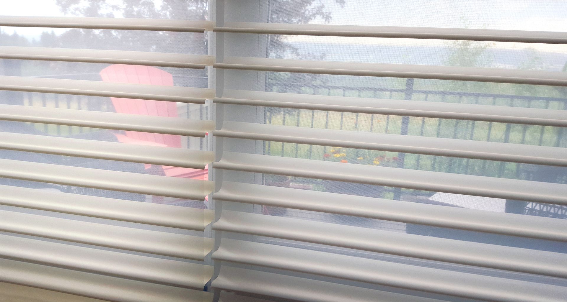 A close up of a window with blinds on it.