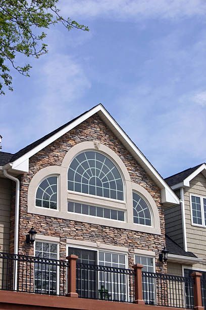 A large house with arched windows and a balcony