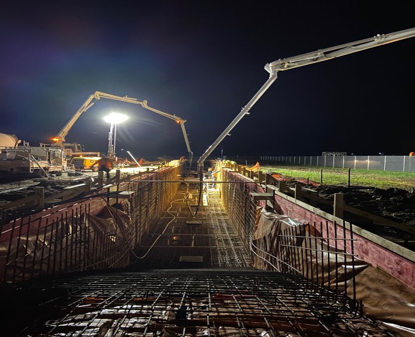 Pumping Trucks And Worker At Night — Concrete Pumping in Berrimah, NT