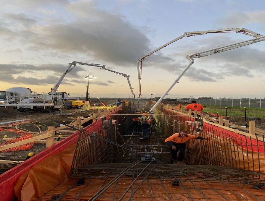 Pumping Trucks And Worker — Concrete Pumping in Berrimah, NT
