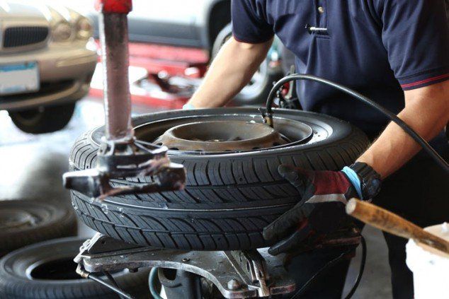 Mechanic fixing tires - Inspection in Ogden, UT