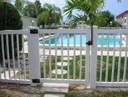 White Fence with Latch, Fence Contractors in St. Petersburg, FL