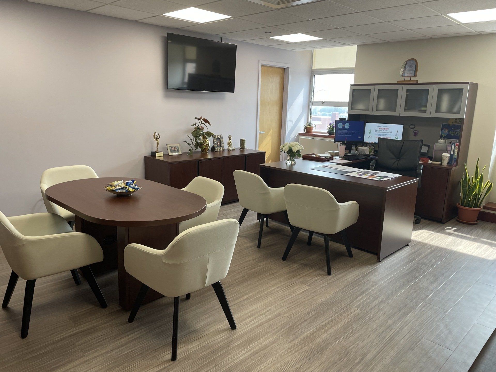 A conference room with a table and chairs in it.