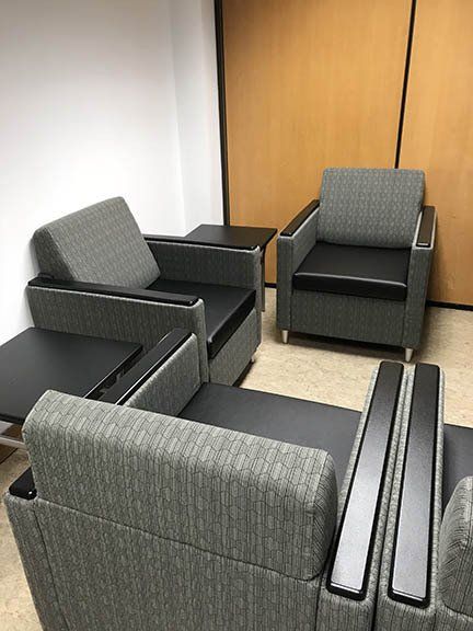 A room with a lot of chairs and tables