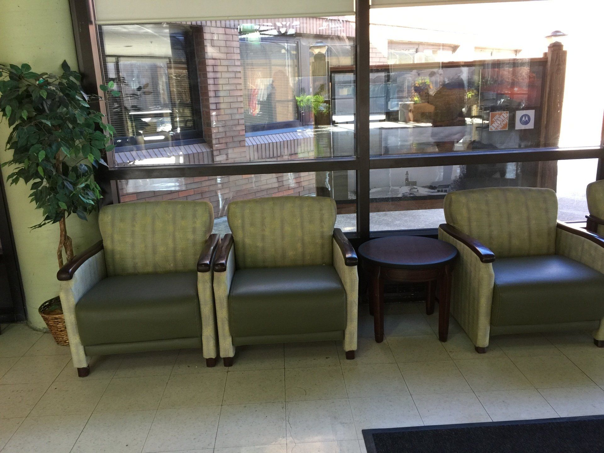 A row of chairs and a table in a waiting room