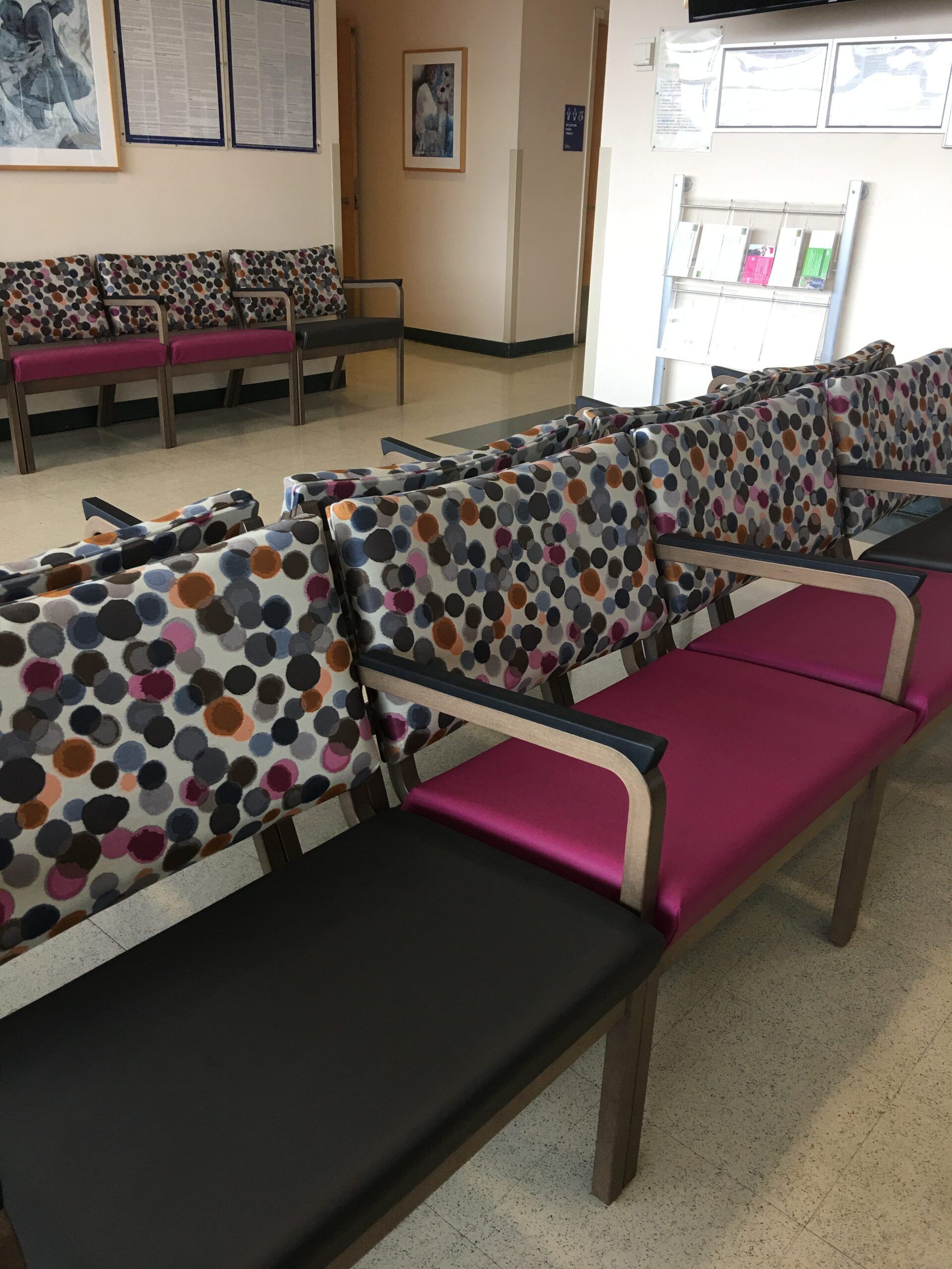 A row of colorful chairs in a waiting room