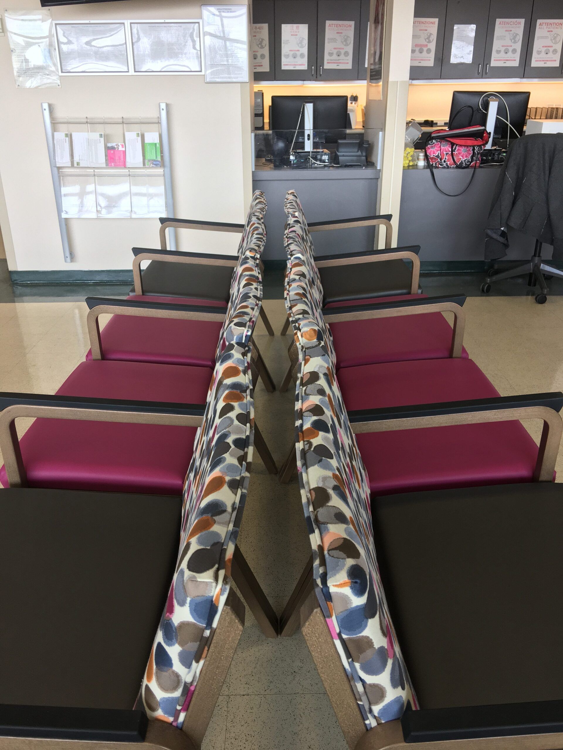 A row of colorful chairs in a waiting room