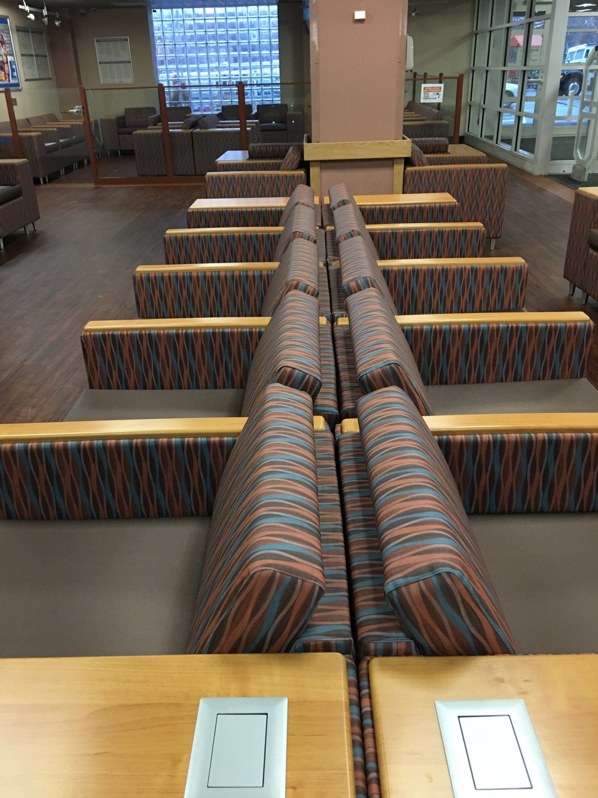 A room with a lot of couches and tables